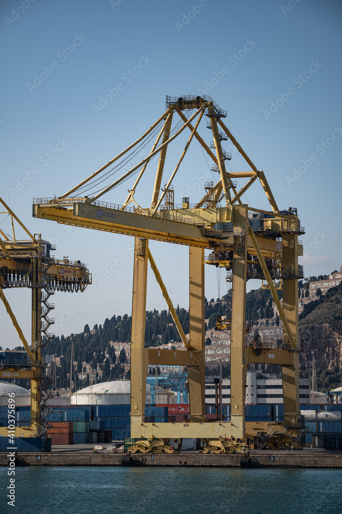 Barcelona, Spain; December 5, 2020: Large crane of the port of barcelona, ​​loading of ships with containers
