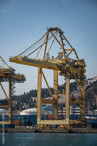 Barcelona, Spain; December 5, 2020: Large crane of the port of barcelona, ​​loading of ships with containers
