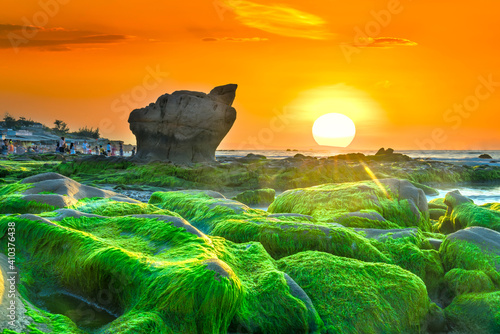 Strange stones covered moss and seaweed welcomes dawn beautiful new day © huythoai