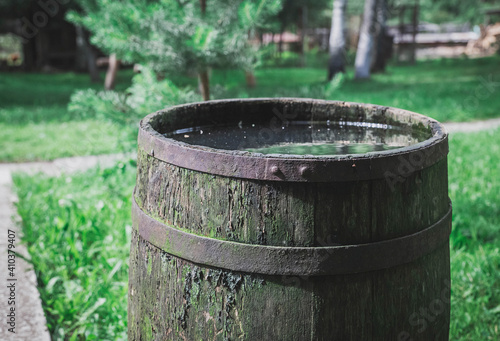 old rotten barrel for collecting rainwater on the farm © Виктор Осипенко