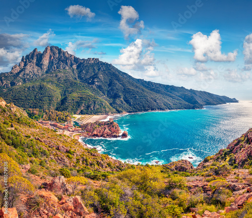 Beautiful marine scenery. Captivating spring cityscape of Porto town with Genoise de Porto Ota tower. Majestic morning view of Corsica island, France, Europe. Exotic Mediterranean seascape.