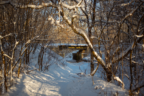 Railway bridge in winter forest