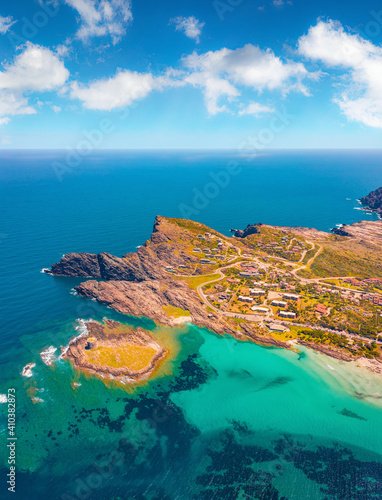 Aerial landscape photography. Colorful summer view from flying drone of Falcone cape and Torre della Pelosa tower. Magnificent morning scene of Sardinia island, Italy, Europe.