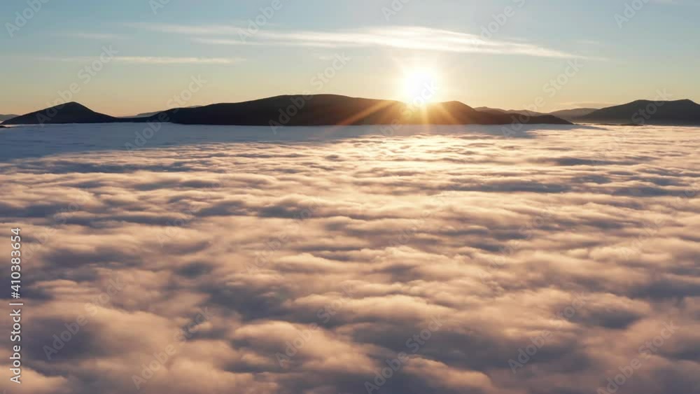 Mountains landscape view with morning sunrsie sun over low dense clouds. Mountains landscape view with morning sunrsie sun over low dense clouds.