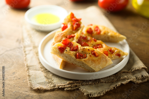 Traditional Italian focaccia bread with tomatoes