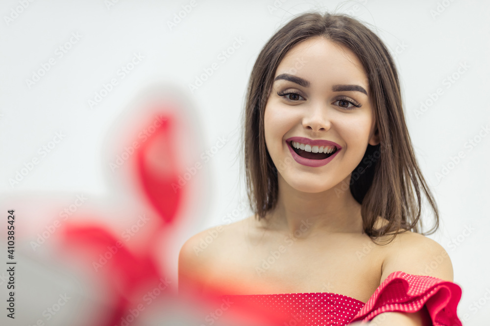 Time for gifts. Completely delighted girl shows her birthday present and enjoys the holiday moment. Time for gifts. Completely delighted girl shows her birthday present and enjoys the holiday moment.