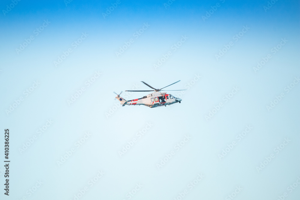 rescue helicopter flying with the door open rescue helicopter flying with the door open