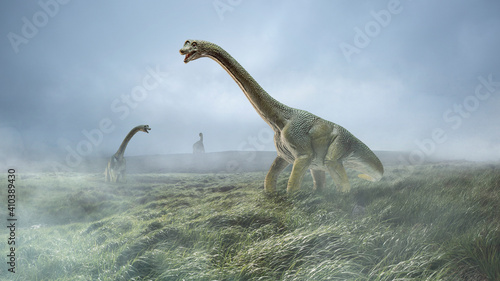 Dinosaurs huge higth walking through the jungle, foggy mountains. Evolution and paleontology, wild nature, wildlife before birth of humanity. Look scary, powerful, unstopped hunters. Jurassic scene. © master1305