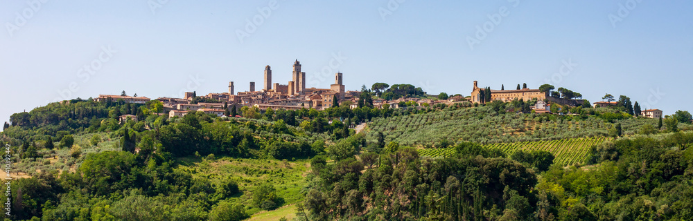 panorama of San Gimignano, a small walled medieval hill town in the province of Siena, Tuscany. Known as the Town of Fine Towers, San Gimignano is famous for its medieval architecture.