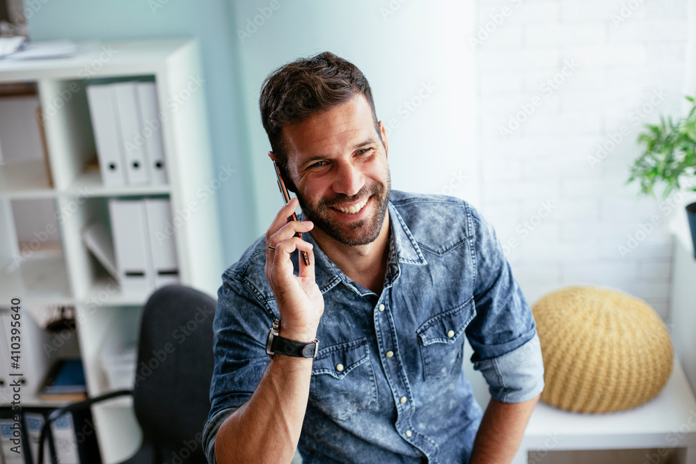 Businessman in office using the phone. Handsome businessman talking to the phone. Businessman in office using the phone. Handsome businessman talking to the phone.