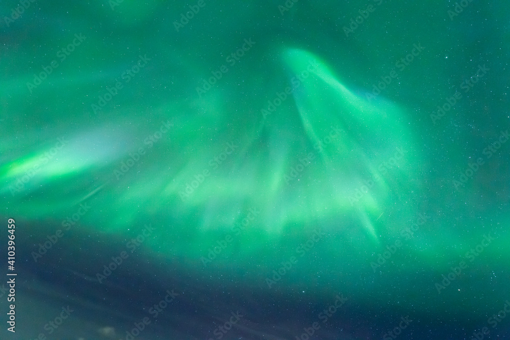 Aurora Borealis corona on the night sky above Lofoten Islands, Norway.