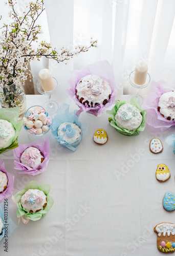 Beautiful Easter cakes on a decorated light table. A light holiday of Easter.