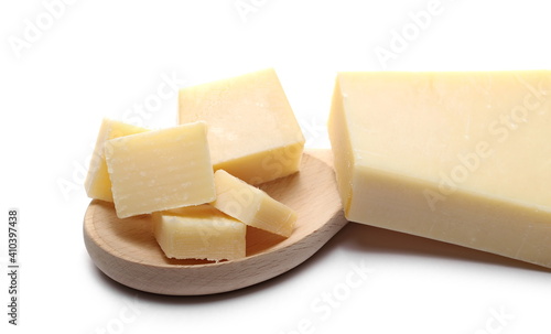 Cheese wedge slices, Italian Grana Padano chunks with wooden spoon isolated on white background