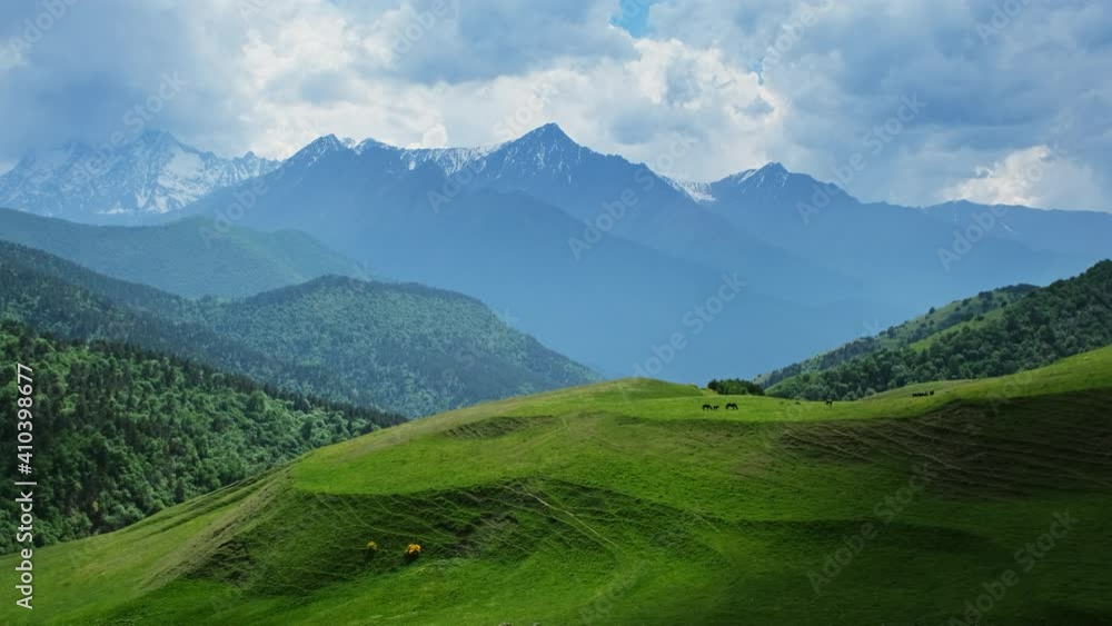 Beautiful summer landscape with horses grazing in mountains at summer, 4k Beautiful summer landscape with horses grazing in mountains at summer, 4k