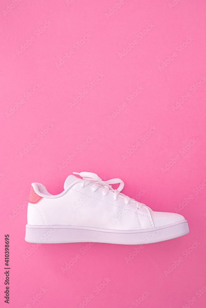 white sneaker on colored background with copy space white sneaker on colored background with copy space