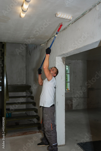 Workman is repairing ceiling.