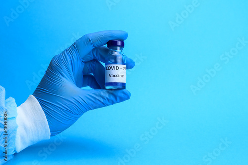 coronavirus vaccine is in the hands of a doctor or nurse. The concept of the fight against covid