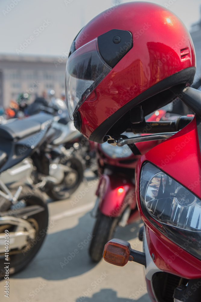 Motorcycle helmet on the handlebars of a motorcycle Motorcycle helmet on the handlebars of a motorcycle