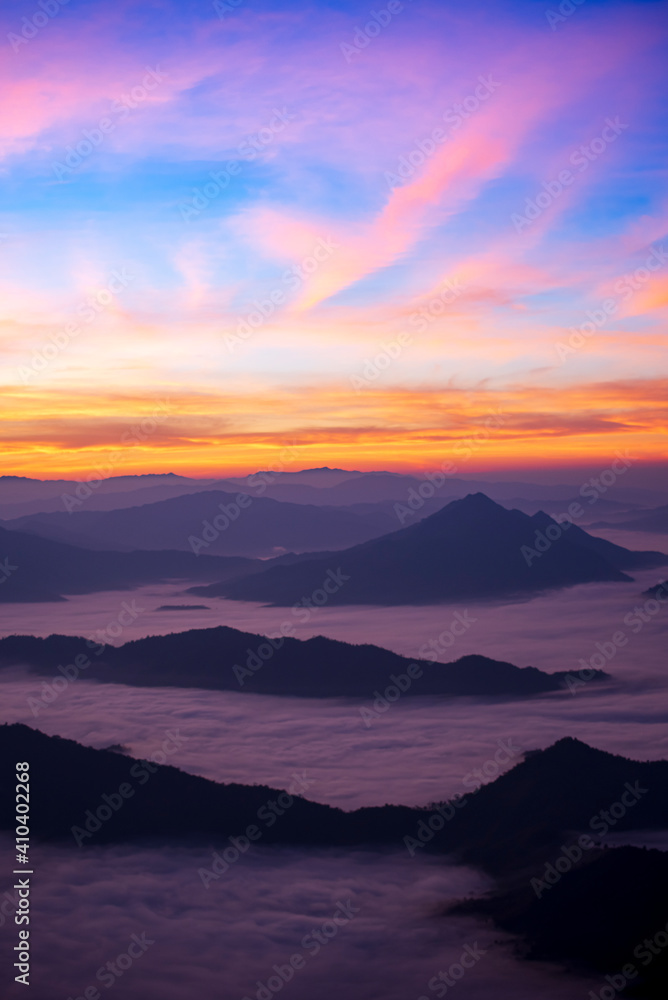 Obraz premium Landscape and starscape of the mountain and sea of mist in winter sunrise view from top of Phu Chi Dao mountain , Chiang Rai, Thailand