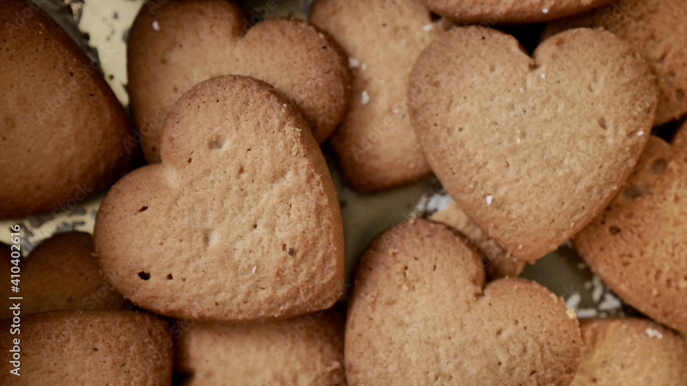 Heart-shaped cookies for Valentine's Day. Background image with sweets. Heart-shaped cookies for Valentine's Day. Background image with sweets.