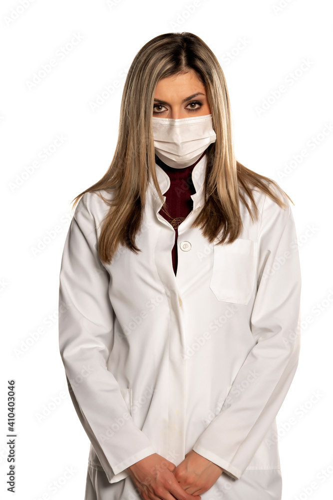 Young unhappy female doctor with face medical mask Young unhappy female doctor with face medical mask