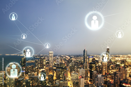 Double exposure of abstract virtual social network icons on Chicago city skyscrapers background. Marketing and promotion concept
