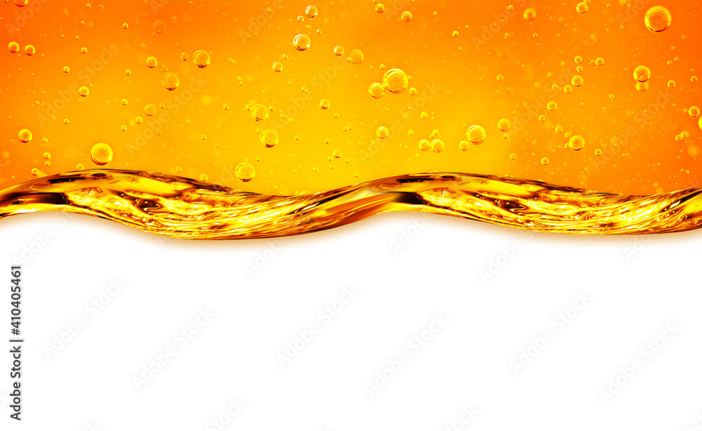 Fototapeta premium Liquid flows yellow, for the project, oil, honey, beer or other variants on white background, area for text. Oil background.