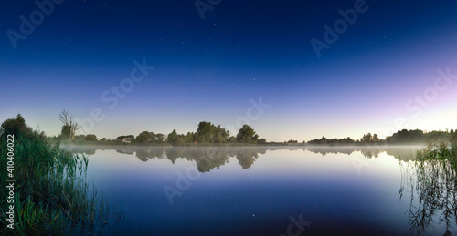 Morning serenity by the lake romance starry sky. © Renatas