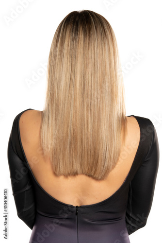 Rear view of a blonde woman with long straith hair
