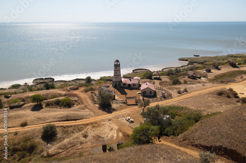 Obraz na płótnie Lighthouse at the beach at the sea w salonie