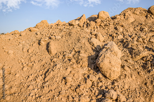 Фотография Heap of construction clay against the sky.