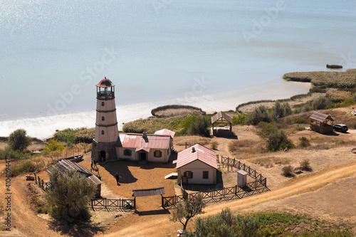 Obraz na płótnie Lighthouse at the beach at the sea w salonie