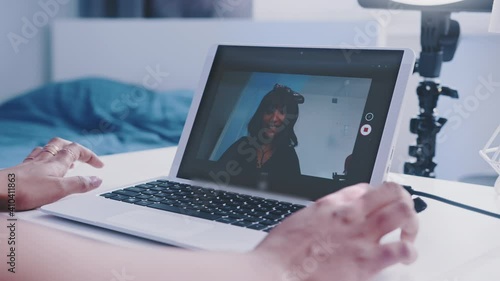 Close up, Woman having video call on her laptop. High quality 4k footage photo