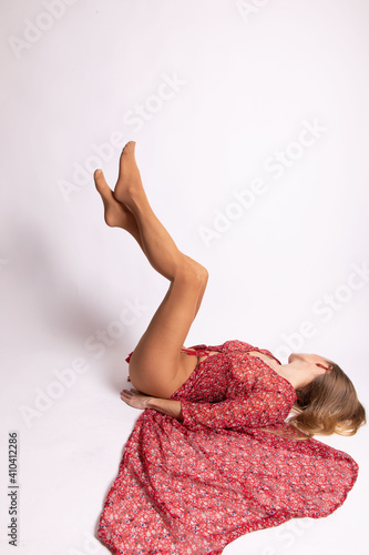 young woman in red dress and beige tights