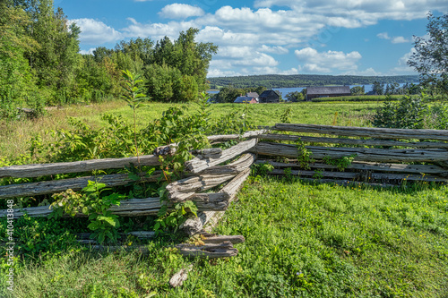 Old split rail fence in a pastoral landscape.