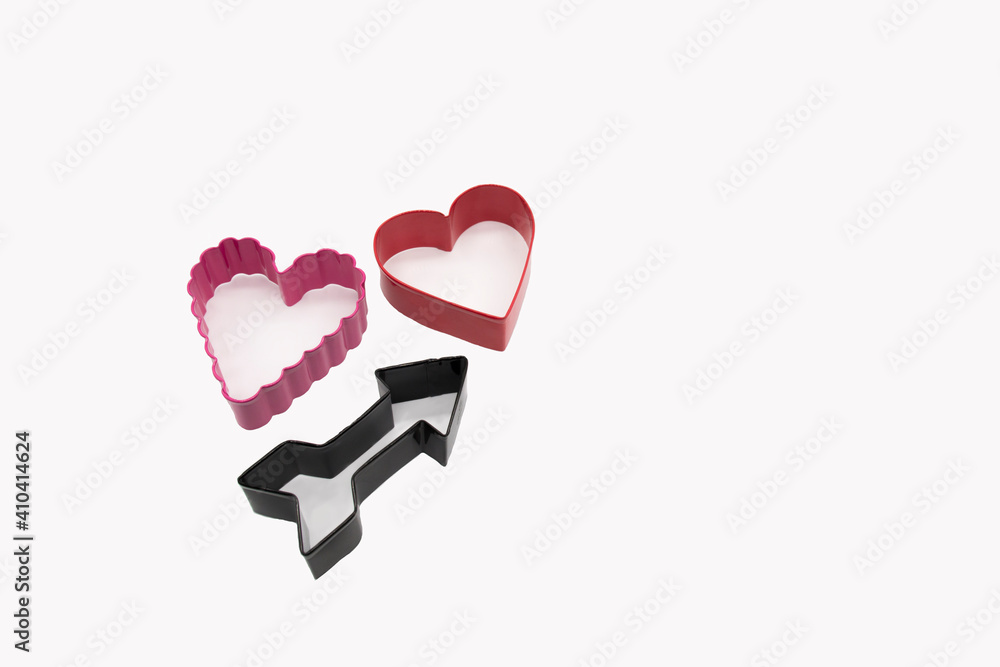 Heart shaped cookie cutters on white background for homemade cookies for Valentines Day. Heart shaped cookie cutters on white background for homemade cookies for Valentines Day.