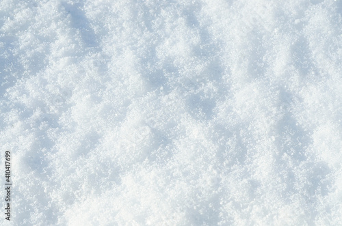 Background of fresh snow texture. Top view of the natural pure snow in winter with copy space. Beautiful abstract snowy white texture for design. Winter landscape. Christmas background. Stock photo