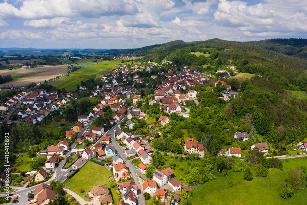 Aerial view of the city and castle Theisenort close to Küps in Germany on a sunny day in spring.	