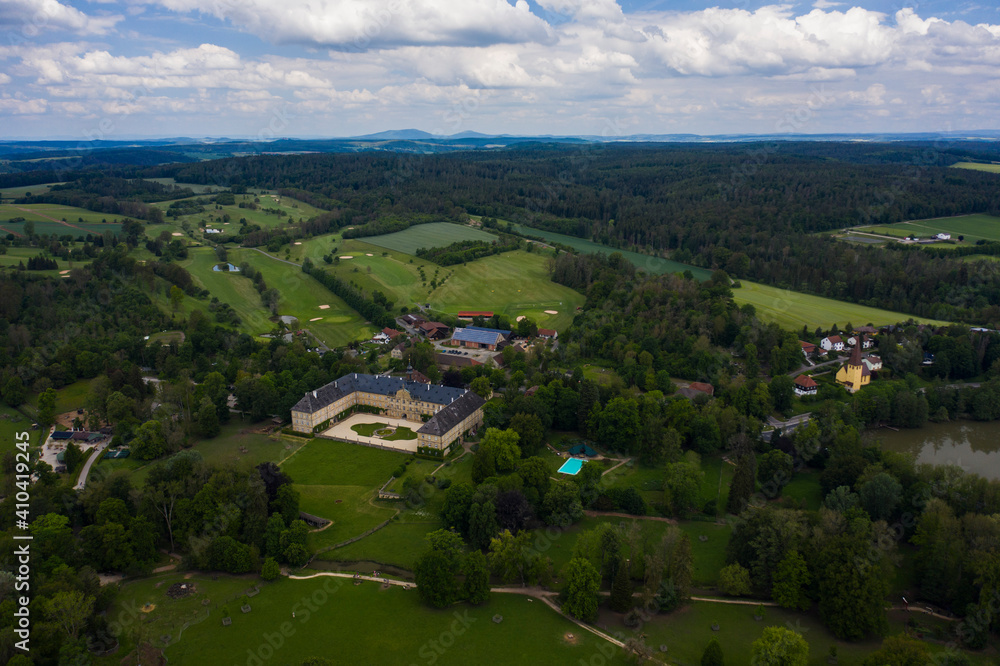 Aerial view of the palace in Tambach close to Weitramsdorf in Germany on a sunny day in spring.	
