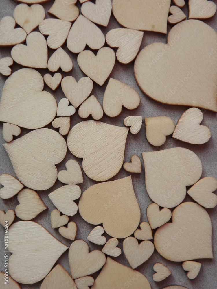 Fototapeta premium valentine's day greeting card-wooden hearts on a gray suede background. High quality photo
