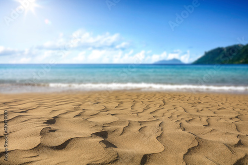 A sunny beach on the warm shores of the blue sea. 