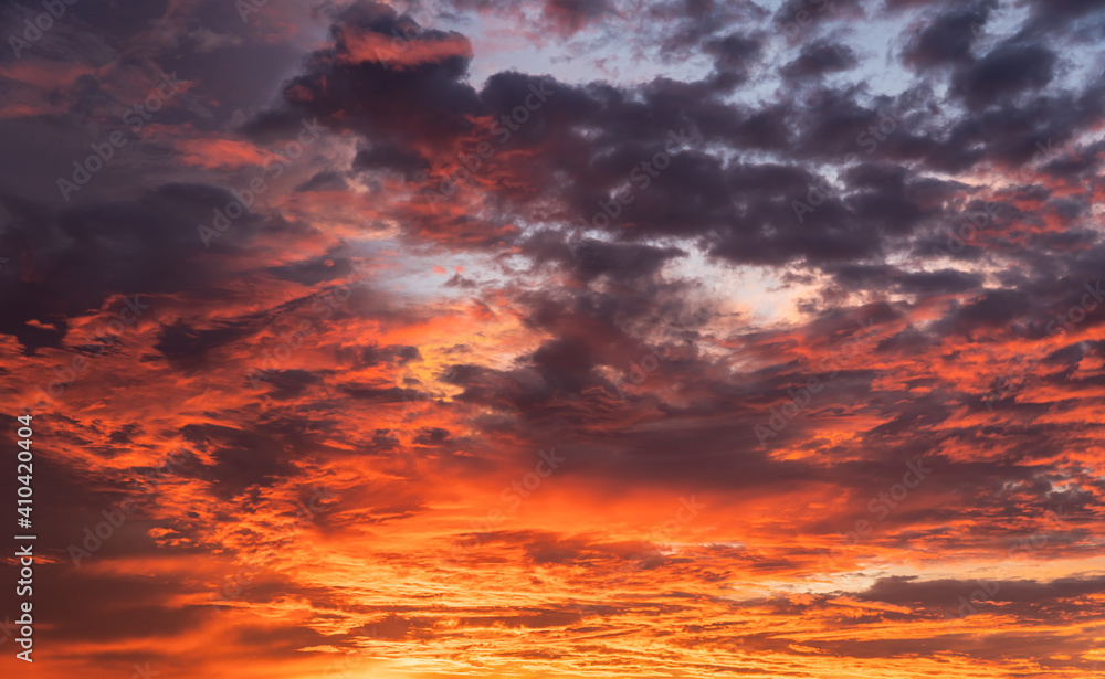 Dramatic sunset sky colorful with majestic red sunlight clouds in the evening 