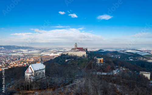 Panormaic arieal photo about Pannonhalama Benedictine abbey in Hungary. Amazing historical building with a beautiful church and library and high school. Chapel of the Blessed Virgin in the foreground.
