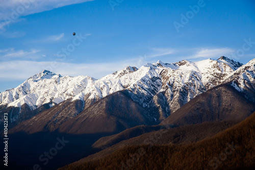 Snow-covered mountains of the Caucasus against a blue sky
