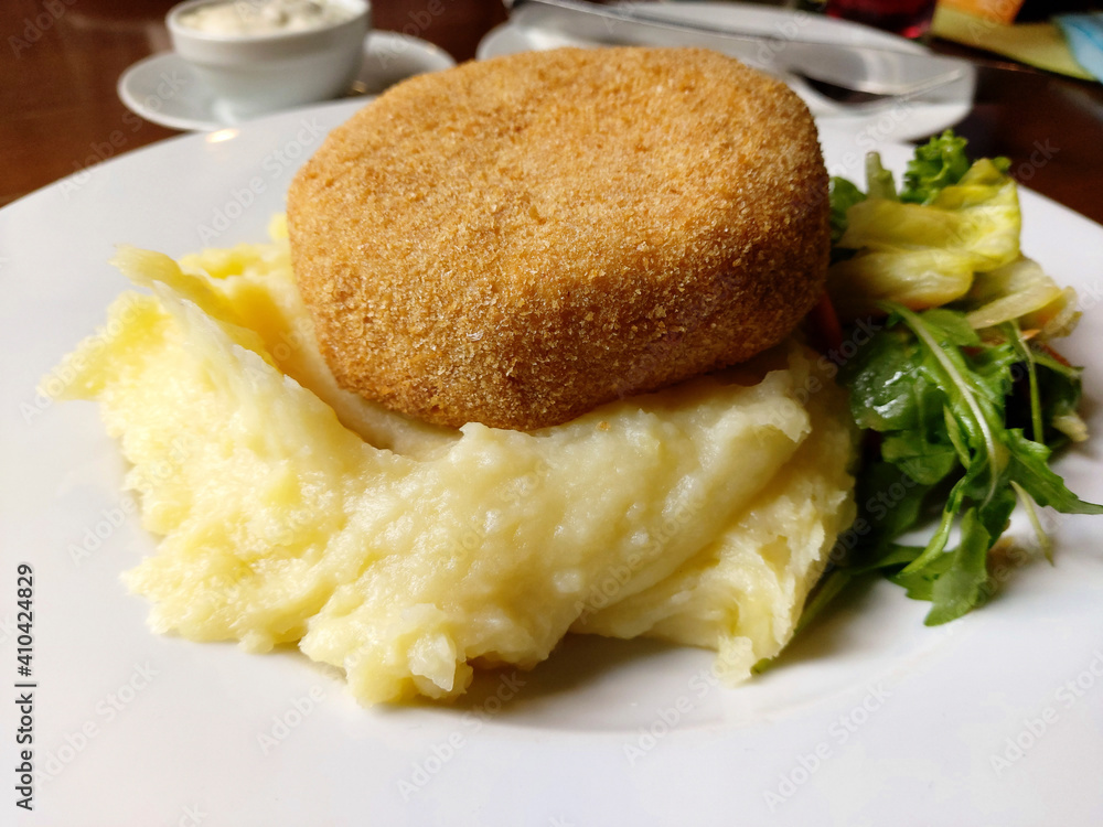 Fried breaded cheese and mashed potatoes gourmet lunch. Fried breaded cheese and mashed potatoes gourmet lunch.