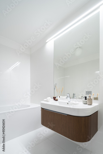 Mirror wall above modern washbasin