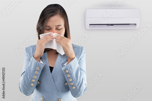 Fotografija Asian woman are closing her nose because musty smell from the air conditioner