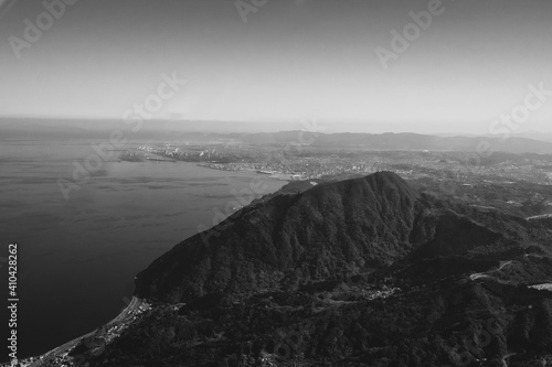 black and white landscape of Mount Takasakiyama in Oita, Japan from a helicopter photo