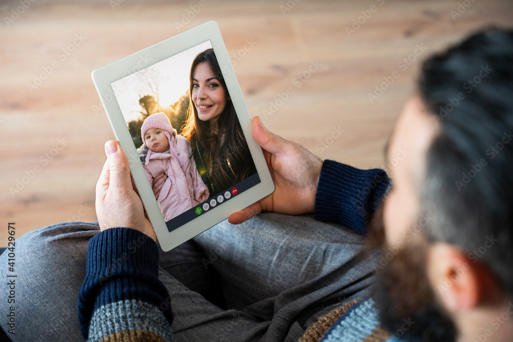 Happy friends in video call on tablet - Mom with little baby girl at the  park meet father online with remote smartphone webcam - Brother hangout  with sister and granddaughter Stock Photo