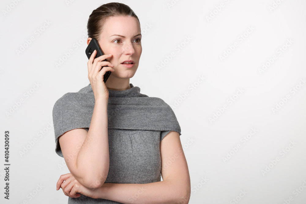 Young woman is using a cell phone
